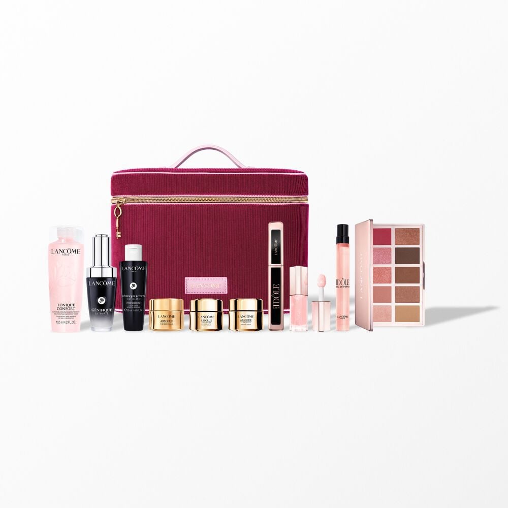 An elegant studio shot of the Lancome Beauty Box Asia collection with premium skincare, makeup, and Idole perfume arranged in front of a cherry-red vanity case.